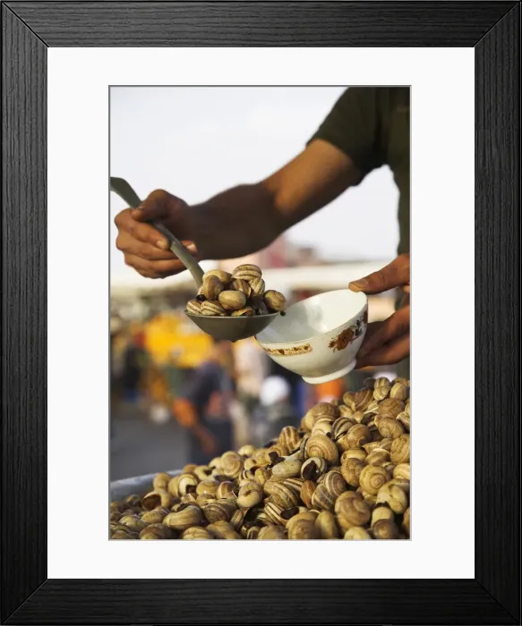 Framed Print : Snails for sale at one of the many food stalls that