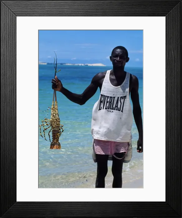 Framed Print : Fisherman with crayfish on the beach at Benguerra Island Framed Print : Fisherman with crayfish on the beach at Benguerra Island