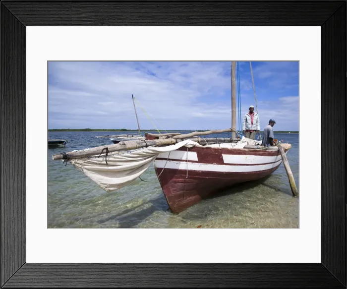 Framed Print : A dhow captain waits for high tide in the harbour of Ibo Island Framed Print : A dhow captain waits for high tide in the harbour of Ibo Island