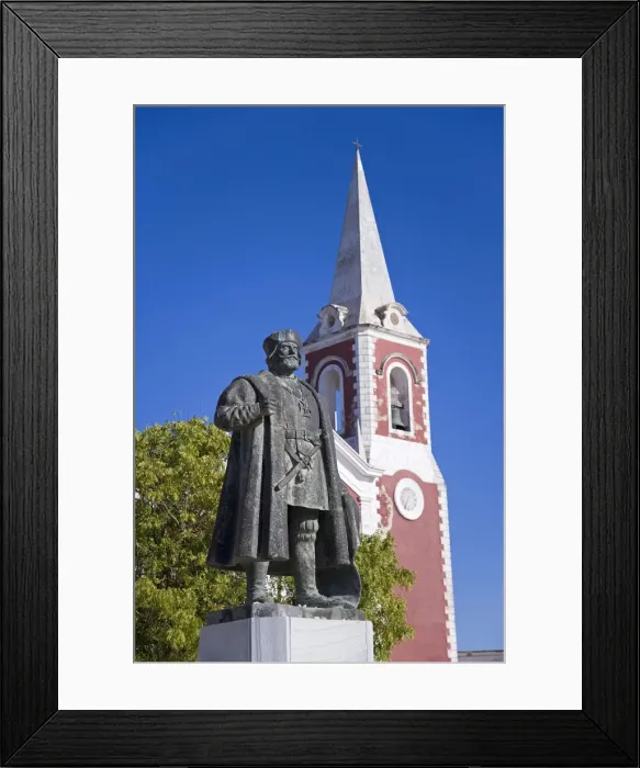 Framed Print : A statue of Vasco de Gama stands in front of the old Framed Print : A statue of Vasco de Gama stands in front of the old