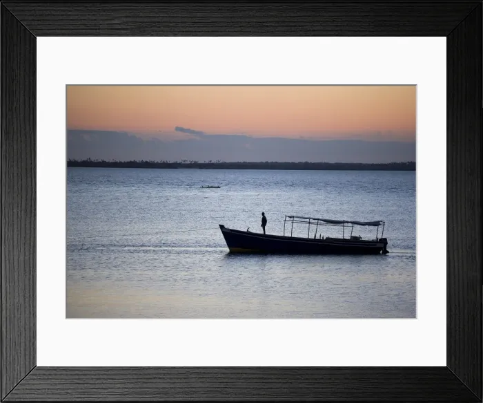 Framed Print : A boat arrives at the Ilha do Mozambique at sunset Framed Print : A boat arrives at the Ilha do Mozambique at sunset