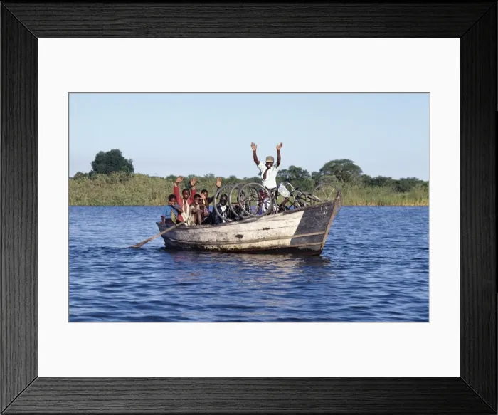 Framed Print : A boat ferries people across the Shire River Framed Print : A boat ferries people across the Shire River