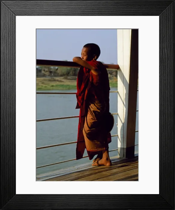 Framed Print : A boy monk gazing out over the rails of a boat on the Irrawaddy River Framed Print : A boy monk gazing out over the rails of a boat on the Irrawaddy River