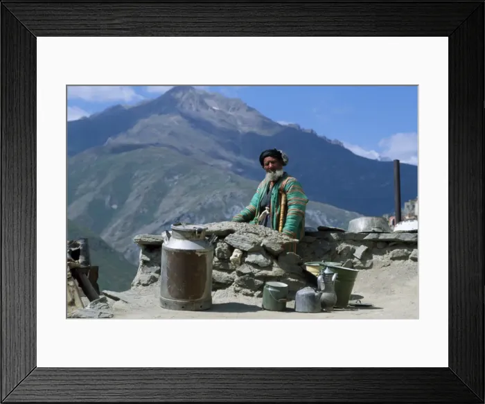 Framed Print : An old man sits beside the dusty road with his pots and milk churn, at Nometkun Framed Print : An old man sits beside the dusty road with his pots and milk churn, at Nometkun