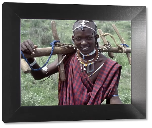 A Wa-Arusha warrior carries home a yoke
