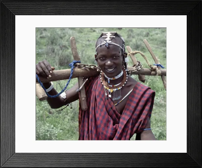 Framed Print : A Wa-Arusha warrior carries home a yoke Framed Print : A Wa-Arusha warrior carries home a yoke