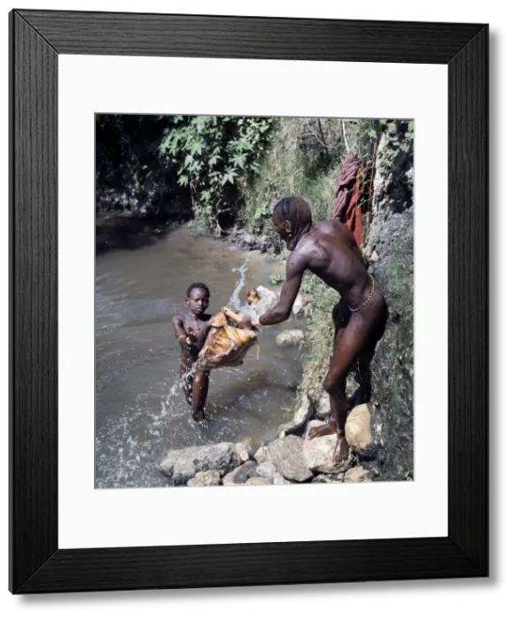 Framed Print : Msai warriors draw water for livestock from a well Framed Print : Msai warriors draw water for livestock from a well