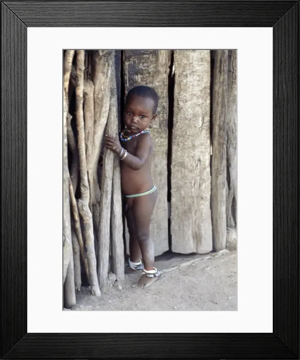 Framed Print : A young Datoga boy attired in beads Framed Print : A young Datoga boy attired in beads