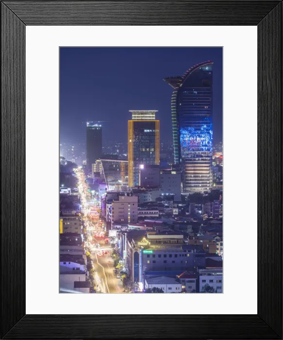 Framed Print : Cambodia, Phnom Penh, elevated city skyline along Monivong Boulevard, dusk Framed Print : Cambodia, Phnom Penh, elevated city skyline along Monivong Boulevard, dusk