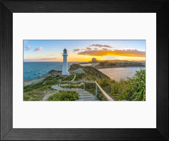 Framed Print : People watching the sun setting down behind Castle Rock and Castlepoint lighthouse Framed Print : People watching the sun setting down behind Castle Rock and Castlepoint lighthouse