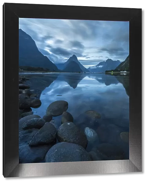 Reflection of Milford Sound at dusk in summer