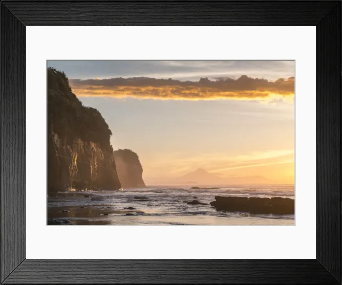 Framed Print : Elephant rock and Mount Taranaki silhouette in the background, at sunset. Tongaporutu Framed Print : Elephant rock and Mount Taranaki silhouette in the background, at sunset. Tongaporutu