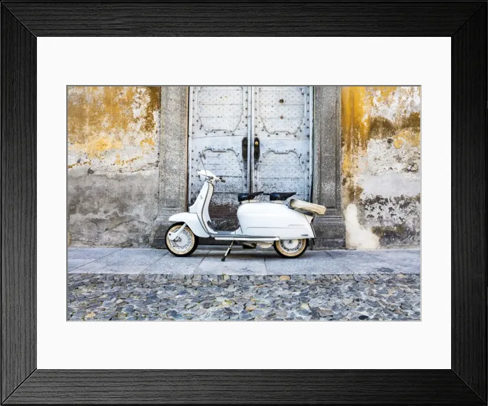 Framed Print : White Lambretta Innocenti scooter in the old town, Morbegno, province of Sondrio