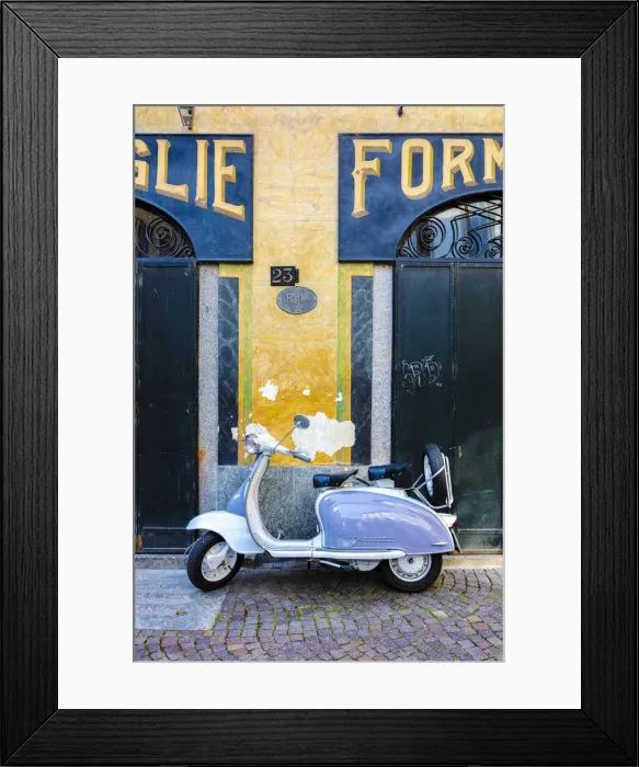 Framed Print : White and grey Lambretta Innocenti scooter parked at the old grocery, Morbegno, Sondrio