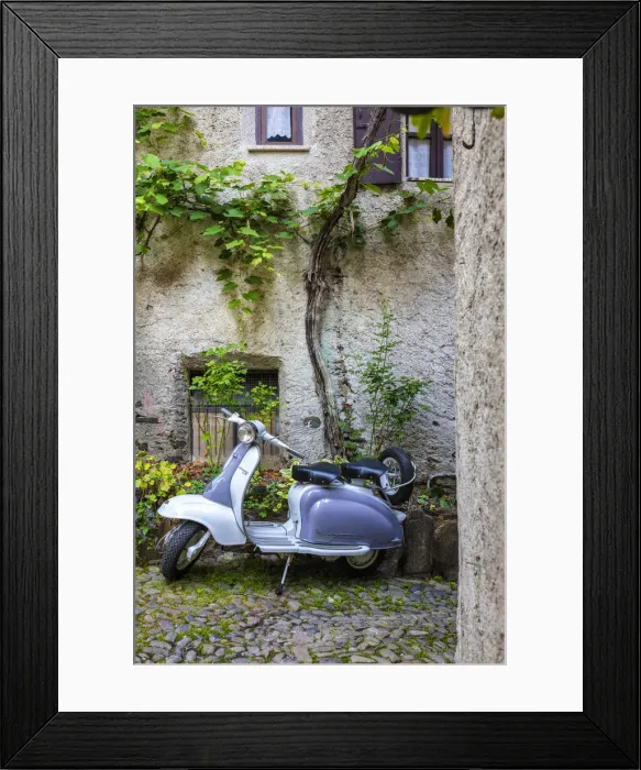 Framed Print : White and grey Lambretta Innocenti scooter in a courtyard, Morbegno, province of Sondrio Framed Print : White and grey Lambretta Innocenti scooter in a courtyard, Morbegno, province of Sondrio