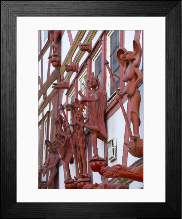 Framed Print : Statues on half-timbered buildings, Limburg, Hesse, Germany Framed Print : Statues on half-timbered buildings, Limburg, Hesse, Germany