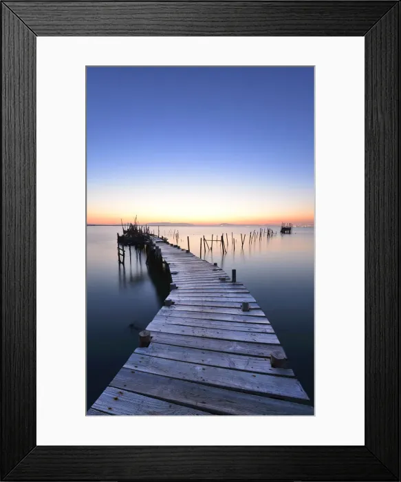 Framed Print : Wooden pillars piers, a palafite fishing harbour of Carrasqueira at dusk. Alentejo Framed Print : Wooden pillars piers, a palafite fishing harbour of Carrasqueira at dusk. Alentejo