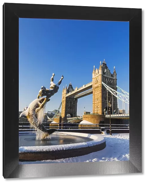 England, London, Tower Hill, The Girl with a Dolphin and Tower Bridge in the Snow