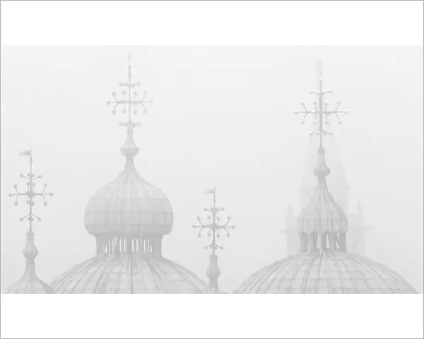 Silhouettes of St. Marks Cathedral and Campanile San Giorgio Maggiore in the fog