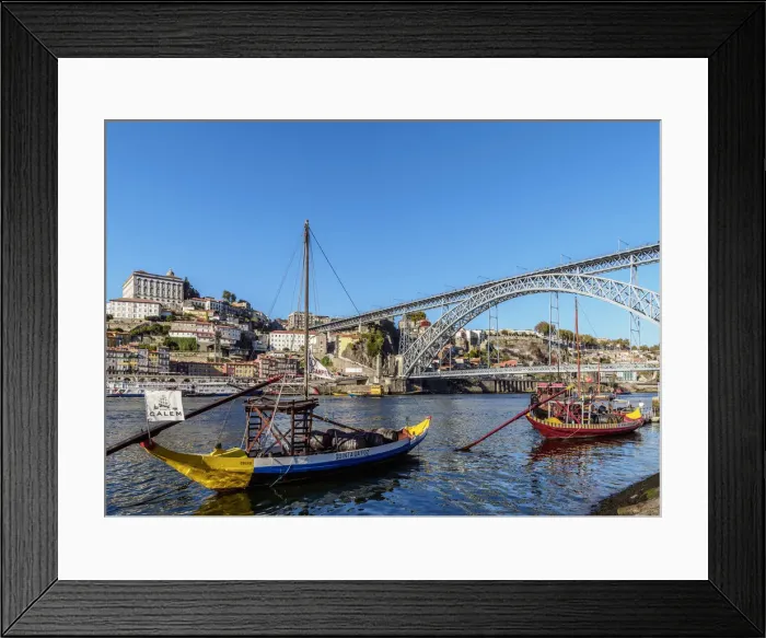 Framed Print : Traditional boats on Vila Nova de Gaia bank of Douro River, Dom Luis I Bridge in Framed Print : Traditional boats on Vila Nova de Gaia bank of Douro River, Dom Luis I Bridge in