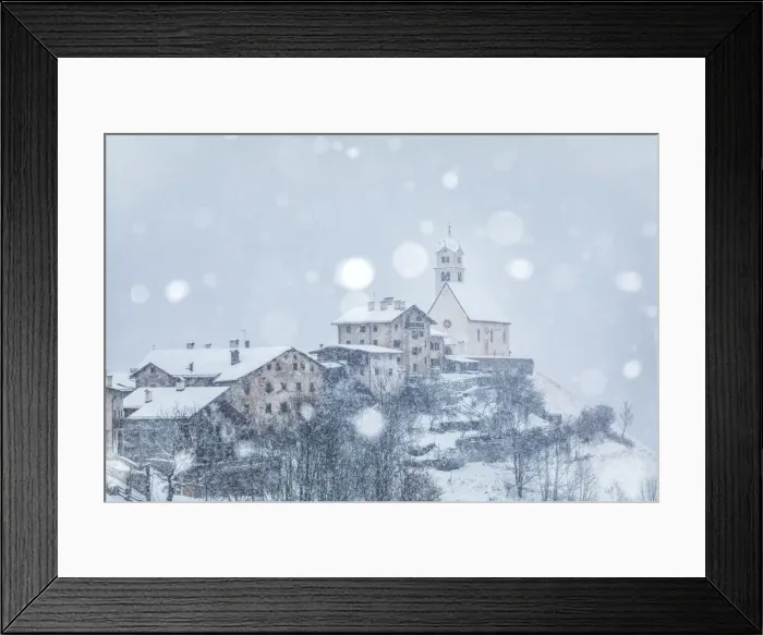 Framed Print : the ancient village of Colle Santa Lucia with the church on the hill under a snowfall Framed Print : the ancient village of Colle Santa Lucia with the church on the hill under a snowfall