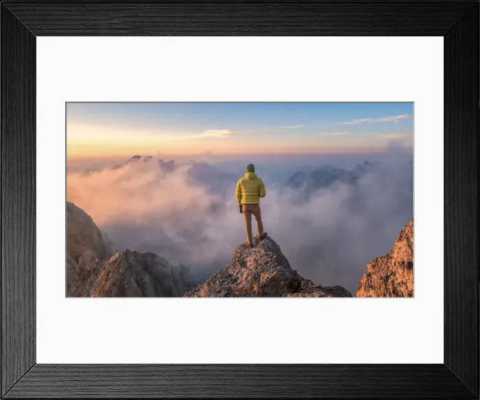 Framed Print : mountaineer admires the landscape at sunrise from a rock spur near Punta Penia, Marmolada Framed Print : mountaineer admires the landscape at sunrise from a rock spur near Punta Penia, Marmolada
