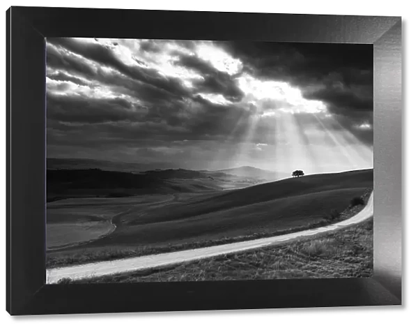 Italy, Tuscany, Val d Orcia listed as World Heritage by UNESCO, suns rays behind
