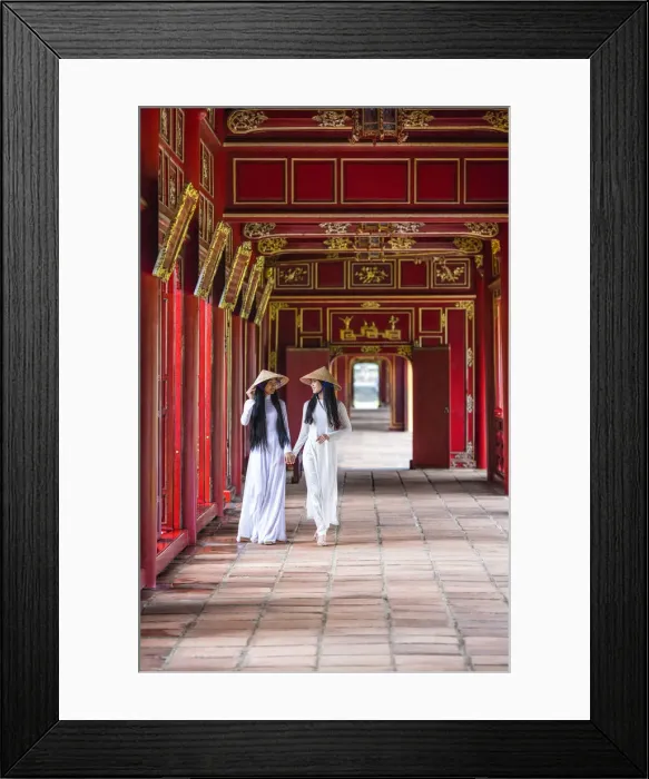 Framed Print : Two young women wearing traditional national costume, ao dai, in the Imperial City Framed Print : Two young women wearing traditional national costume, ao dai, in the Imperial City
