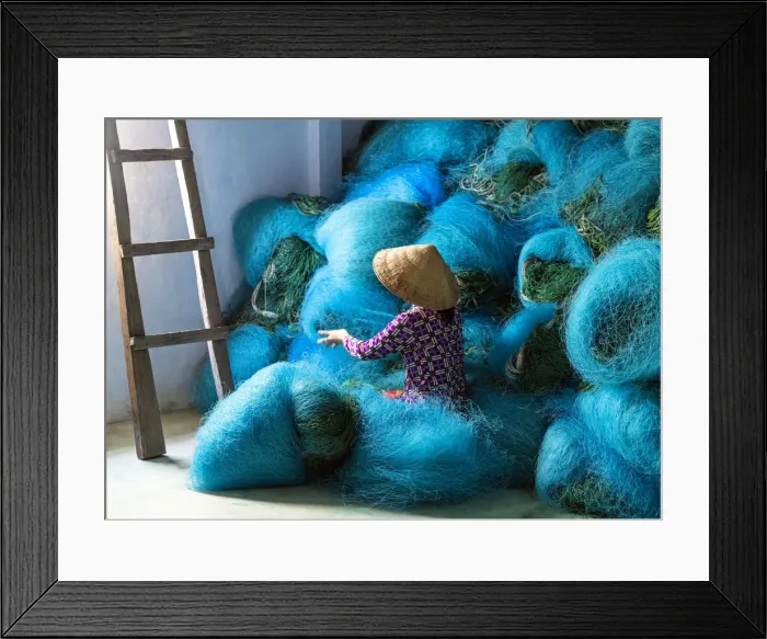 Framed Print : A Vietnamese woman mending blue fishing net, Mekong Delta, Vietnam Framed Print : A Vietnamese woman mending blue fishing net, Mekong Delta, Vietnam