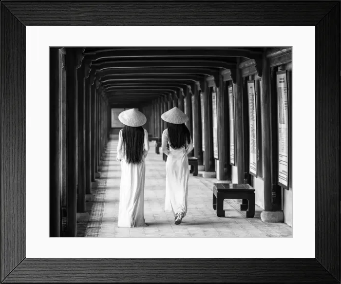 Framed Print : Two young women wearing traditional national costume, ao dai, in the Imperial City Framed Print : Two young women wearing traditional national costume, ao dai, in the Imperial City