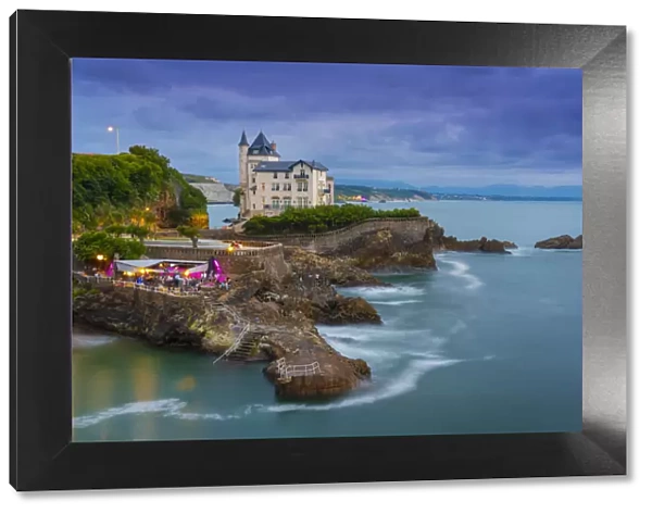 France, Aquitaine, Pyrenees Atlantiques, Biarritz. Old mansion on the cliffs at dusk