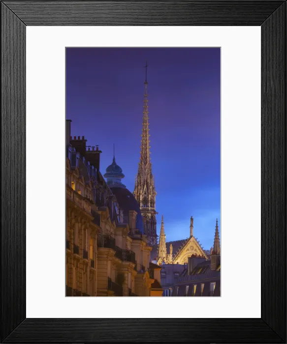 Framed Print : France, Paris, Notre Dame Cathedral, spire above rooftops at dusk