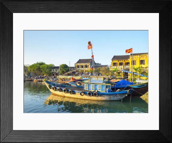 Framed Print : Boats on the Thu Ban'n River in front of Hoi An Ancient Town in late afternoon, Hoi An