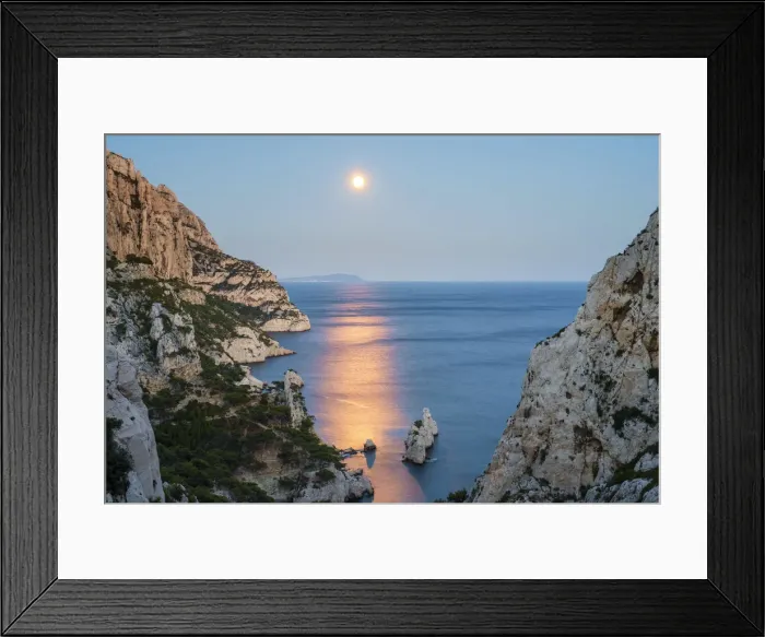 Framed Print : Full moon rising over ocean and Mediterranean landscape and Calanque de Sugiton at dusk Framed Print : Full moon rising over ocean and Mediterranean landscape and Calanque de Sugiton at dusk