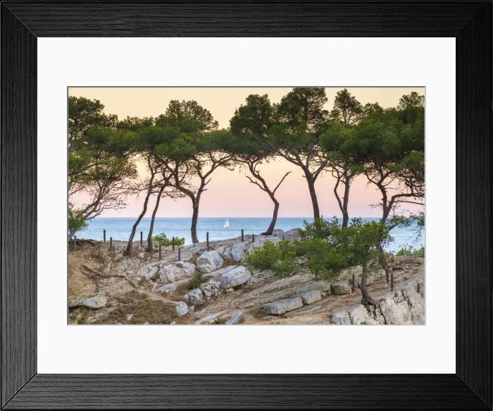 Framed Print : Sailboat passing Mediterranean landscape at Calanque de Sugiton at sunset, Parc National Framed Print : Sailboat passing Mediterranean landscape at Calanque de Sugiton at sunset, Parc National