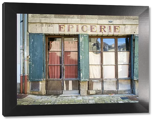 Abandoned storefront vintage painted sign of old Epicerie market store, Aubusson