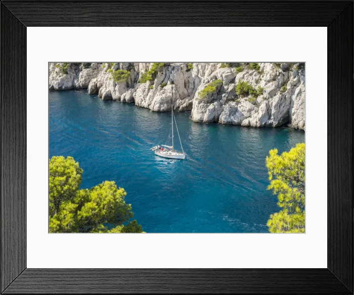Framed Print : Sailboat passing through emerald blue water of Calanque de Port-Pin, Cassis Framed Print : Sailboat passing through emerald blue water of Calanque de Port-Pin, Cassis