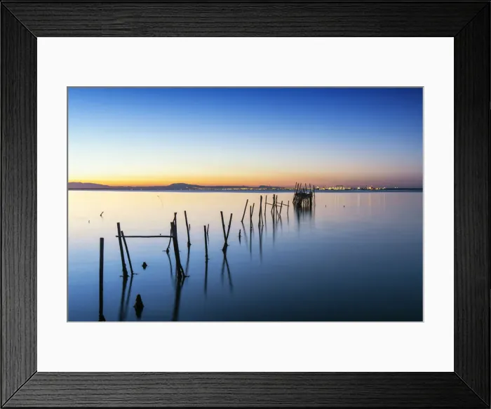 Framed Print : Wooden pillars pier, the palafite fishing harbour of Carrasqueira at dusk. Alcacer do Sal Framed Print : Wooden pillars pier, the palafite fishing harbour of Carrasqueira at dusk. Alcacer do Sal