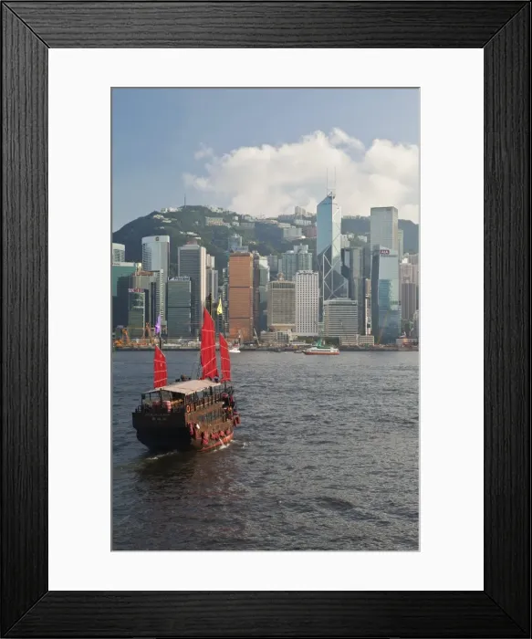 Framed Print : One of the last remaining Chinese sailing junks on Victoria Harbour, Hong Kong, China, Asia, viewed from Kowloon, Central skyine beyond