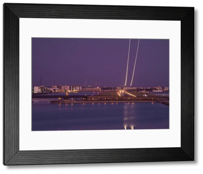 Framed Print : England, London, Newham, Royal Victoria Docks, London city airport, Plane taking off at night Framed Print : England, London, Newham, Royal Victoria Docks, London city airport, Plane taking off at night