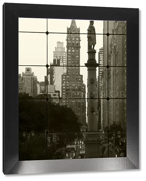USA, New York City, Manhattan, Statue of Christopher Columbus in Columbus Circle viewed through a glass shopping