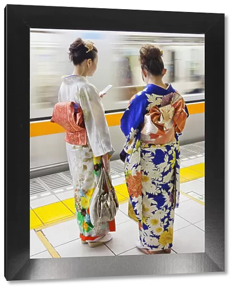 Japan, Tokyo, Girls in Kimono on Subway Platform