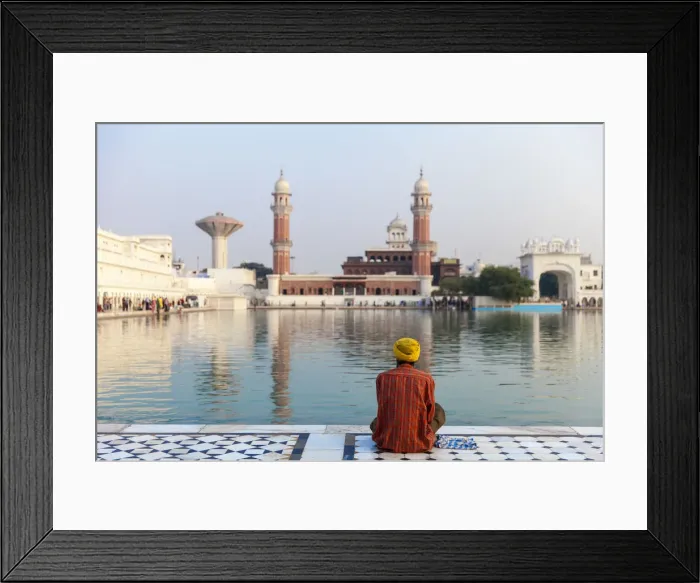 Framed Print : India, Punjab, Amritsar, Pilgrim sitting infront of The Harmandir Sahib, known as