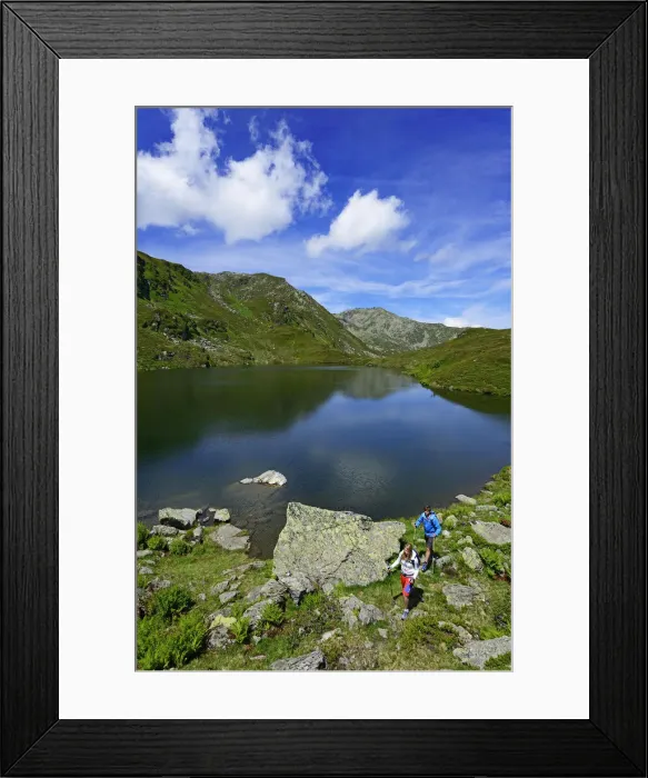 Framed Print : Hikers on the Lower Wildalmsee on the way to Schafsiedel, Kelchsau, Kitzbuhel Alps