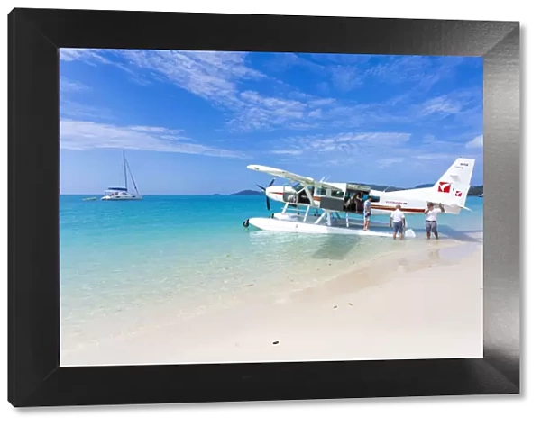Cessna landed on Whitehaven Beach, Whitsundays. Queensland, Australia