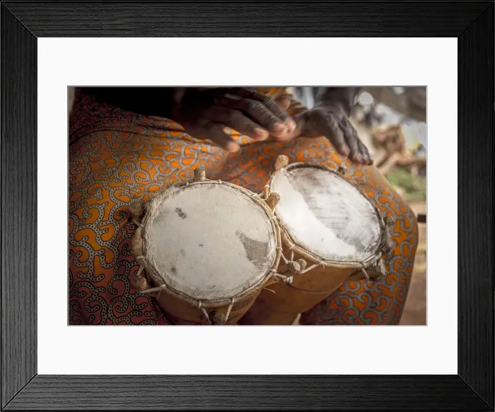 Framed Print : Africa, Benin, Porto Novo, Ajara. A drum player with a double bongo drum Framed Print : Africa, Benin, Porto Novo, Ajara. A drum player with a double bongo drum