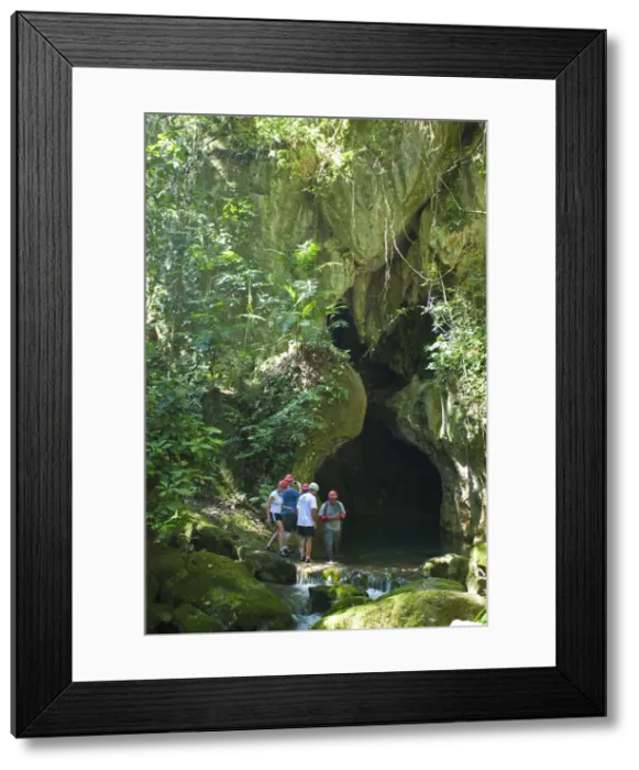 Framed Print : Central America, Belize, Cayo, a guide escorts tourists into the Actun Tunichil Muknal Framed Print : Central America, Belize, Cayo, a guide escorts tourists into the Actun Tunichil Muknal