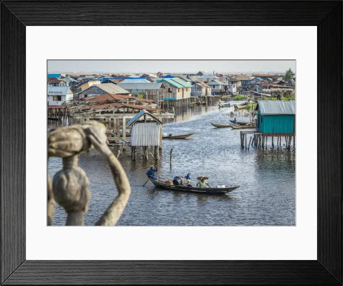 Framed Print : Africa, Benin, Ganvie. View over the channel with stilt houses and canoes Framed Print : Africa, Benin, Ganvie. View over the channel with stilt houses and canoes