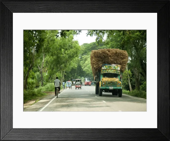 Framed Print : Khulna, Bangladesh. Loaded trucks bring crops from the countryside to the centre of Framed Print : Khulna, Bangladesh. Loaded trucks bring crops from the countryside to the centre of