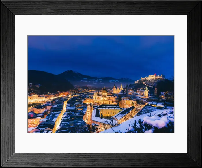 Framed Print : Elevated view of Salzburg city by night on a winter evening with the roofs covered Framed Print : Elevated view of Salzburg city by night on a winter evening with the roofs covered